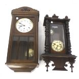 Two pendulum wall clocks.