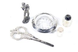 An assortment of silver and white metal collectables.