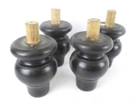 Four substantial ebonised turned wood furniture supports/feet.