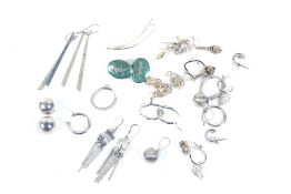 A collection of approximately 16 pairs of silver or white metal stud and pendent earrings.