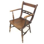 A Victorian Arts and Crafts carver chair.