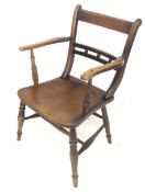 A Victorian Arts and Crafts carver chair.