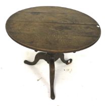 A 20th century oak tilt top table.