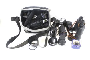 A mixed collection of film cameras, accessories, etc. Including an Olympus OM10.