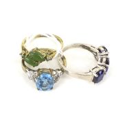 A QVC 9ct gold, oval blue-topaz and tiny diamond dress ring and two others.