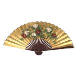 A large contemporary Chinese fan. With red lacquer struts and floral decoration on paper. 89cm long.