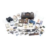 An assortment of collectables. Including a watch, inkwell, medals, jewellery, etc.