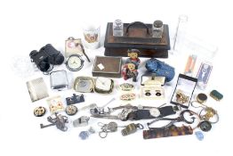 An assortment of collectables. Including a watch, inkwell, medals, jewellery, etc.