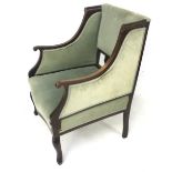 An Edwardian mahogany inlaid upholstered armchair. Serpentine front, on cabriole legs.