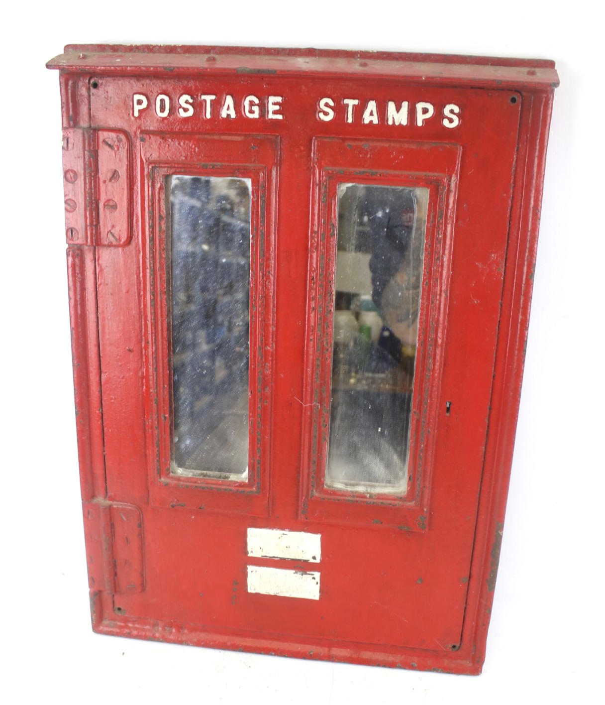 A vintage GPO 'Postage Stamps' cast metal vending front. Converted with two mirror sections.