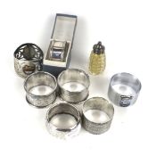 Three silver napkin rings and other items.