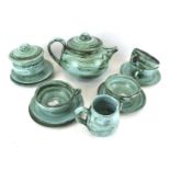 A studio pottery tea service. Including pot, sugar bowl, jug and four cups and saucers, etc. Max.