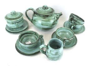 A studio pottery tea service. Including pot, sugar bowl, jug and four cups and saucers, etc. Max.