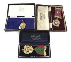 Three silver-gilt and polychrome enamelled medals.