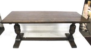 A dark oak refectory style dining table.