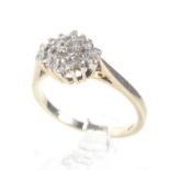 A modern 9ct gold and diamond cluster ring. The 23 round brilliant cut stones circa 0.