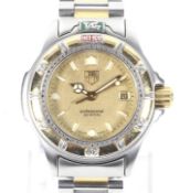 Tag Heuer, Professional 200 Meters, a lady's stainless steel and gilt bracelet watch.