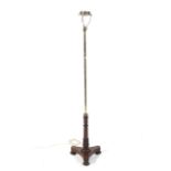 A Georgian brass and rosewood pole screen now formed as a standard lamp,