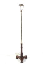 A Georgian brass and rosewood pole screen now formed as a standard lamp,