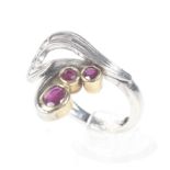 A ruby and diamond abstract leaf and scroll ring by Erica Sharpe.