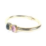 A vintage German tourmaline two stone hinged torque bangle.