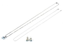 A modern 9ct white gold aquamarine pendant and chain and a pair of matching stud earrings.