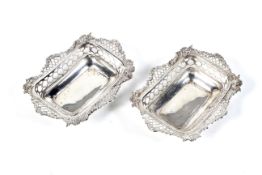 A pair of late Victorian silver pierced-oblong sweet dishes.