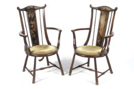 Arts & Crafts - a pair of mahogany circular open armchairs