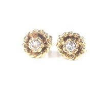 A pair of vintage 18ct gold and small diamond stud earrings. Each round brilliant approx. 0.