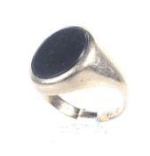A vintage gold and black onyx oval signet ring.