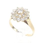 A vintage diamond cluster ring. The 21 graduated round brilliant diamonds approx. 0.