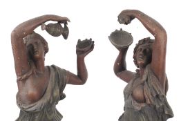 A pair of metal figures of Hebe and the eagle Zeus, and Amphictyonis, goddess of wine.