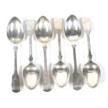 A set of six Victorian silver fiddle pattern dessert spoons.