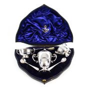 A late Victorian silver campana shaped three piece cruet set.