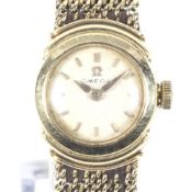 Omega, a lady's 18ct gold round bracelet watch, circa 1980.