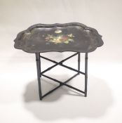 An early 19th century lacquered papier mache tray and faux bamboo stand.