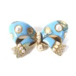 A Victorian gold, turquoise enamel and half-pearl bow brooch.