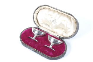 A pair of silver oval pedestal salts in George III style.