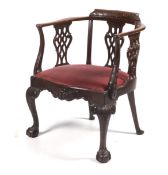 A Georgian style Victorian mahogany open armchair.
