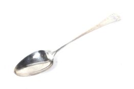 A George III silver old English pattern serving spoon.