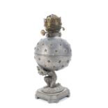 Oil lamp: the brass base formed as Charles Atlas holding a globe.
