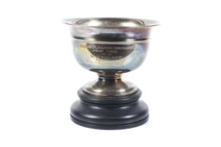 A silver trophy bowl.