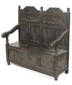 A 19th century dark oak wood settle.