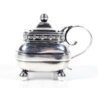 A George III silver oblong mustard pot.