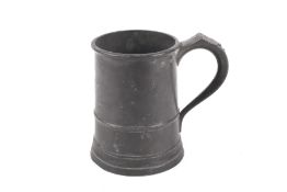 A 19th century pewter quart tankard, with name and address inscribed to the body. H14.