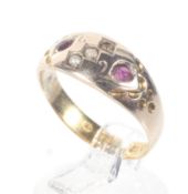 A late Victorian gold and gem set gypsy-type ring.