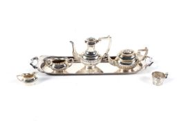 A vintage miniature silver oval part spiral-fluted four piece tea and coffee service on a