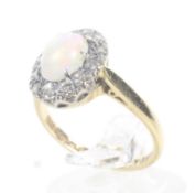 A vintage 18ct gold opal and diamond and oval cluster ring.