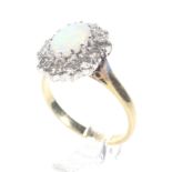 A vintage 18ct gold, opal and diamond oval cluster ring.