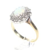 A vintage 18ct gold, opal and diamond oval cluster ring.